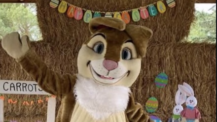 The Easter bunny waving waiting to welcome new friends at Brooks Farm this weekend for Easter Fest